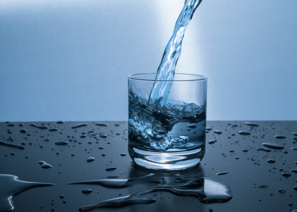 Glass of water being poured